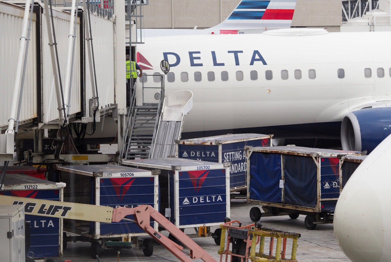 A passengers waits for a Delta Airlines flight in Terminal 5 at Los Angeles International Airport, May 4, 2017 in Los Angeles, California. In yet another incident that could prove a public relations nightmare for the airline industry, a California couple has come forward claiming they were kicked off an overbooked Delta flight for refusing to give up their child's seat. The incident unfolded last week as the Schear family of Huntington Beach were flying back home from Hawaii to Los Angeles.