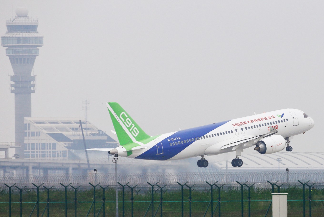 China's home-grown C919 passenger jet takes off from Pudong International Airport on its maiden flight in Shanghai on May 5, 2017. The first large made-in-China passenger plane took off on its maiden test flight on May 5, marking a key milestone on the country's ambitious journey to compete with the world's leading aircraft makers.