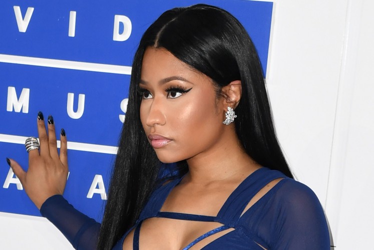 This file photo taken on August 28, 2016, shows Nicki Minaj attending the 2016 MTV Video Music Awards at Madison Square Garden in New York. Minaj has promised to pay university tuition for dozens of fans after a promotional contest metamorphosed over Twitter. Minaj's transformation into educational benefactor took place over the weekend of May 6 and 7, 2017, as she unveiled a contest of the sort popular among celebrities seeking an online buzz.