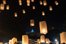 Lanterns are released into the sky.
