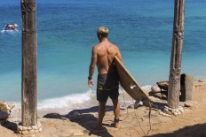 Nudist beach surfer punches shark to escape attack