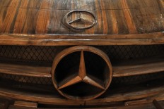 The Mercedes-Benz logo is on the hood of a wooden replica, which has already been painted. JP/Magnus Hendratmo