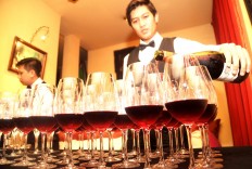 Drink up: A waiter pours Chilean wine, one of the world’s best.