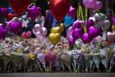 Manchester marks week since attack as intelligence questions grow