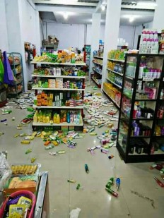 Natural calamity: A 6.6 Ritcher scale shatters goods displayed in a grocery story in Poso, Central Sulawesi, on May 29. 