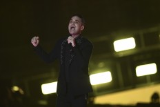 Take that, Elvis! Robbie Williams equals UK album chart record