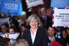 Tory faithful hail May, their strong and stable leader