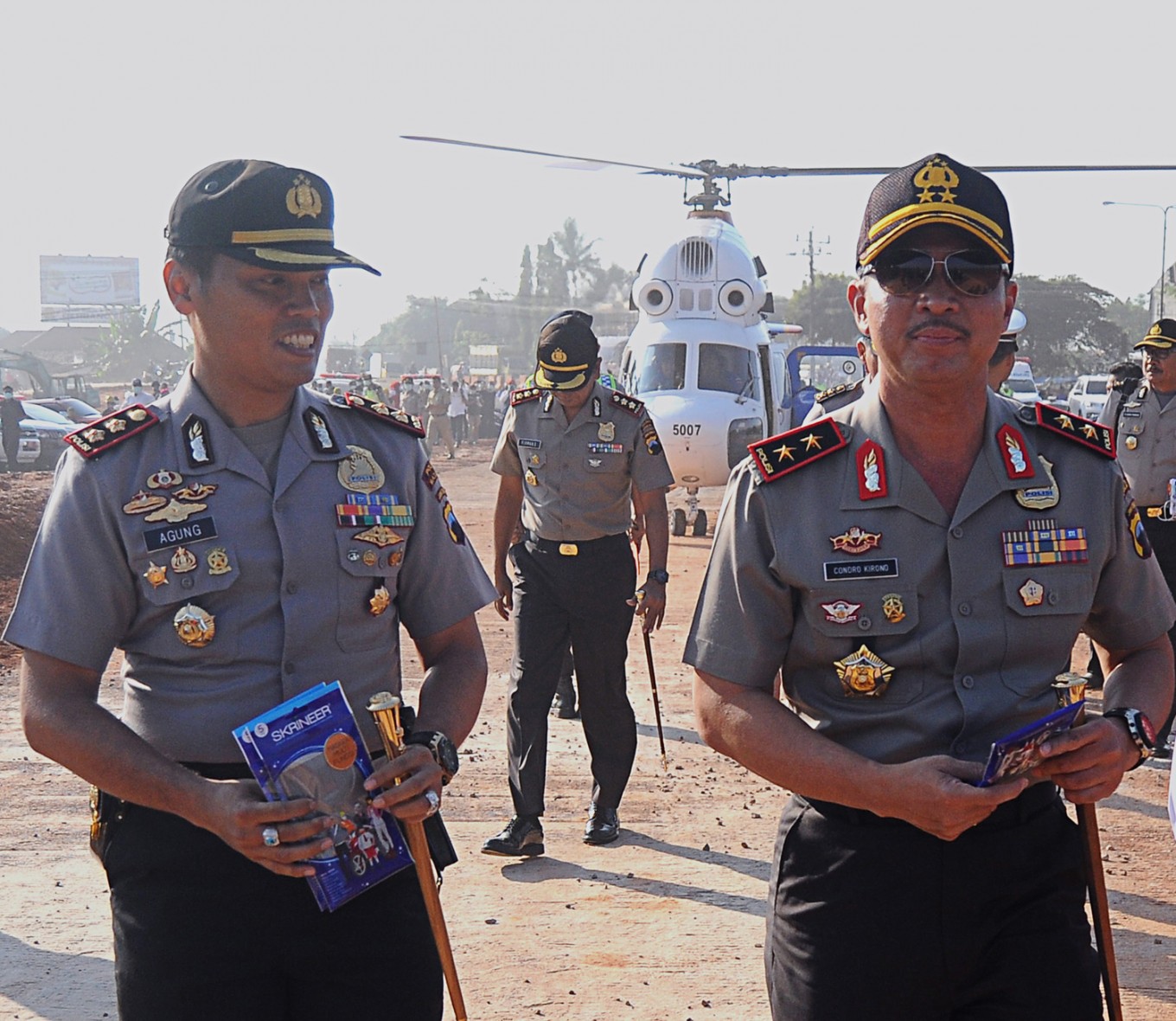 Central Java Police chief Insp.Gen. Condro Kirono (right), accompanied by Batang Police chief Adj.Sr.Comr. Juli Agung Pramono (left), inspects progress of the development of Pemalang-Batang toll roads in Batang regency, Central Java, on June 5.  