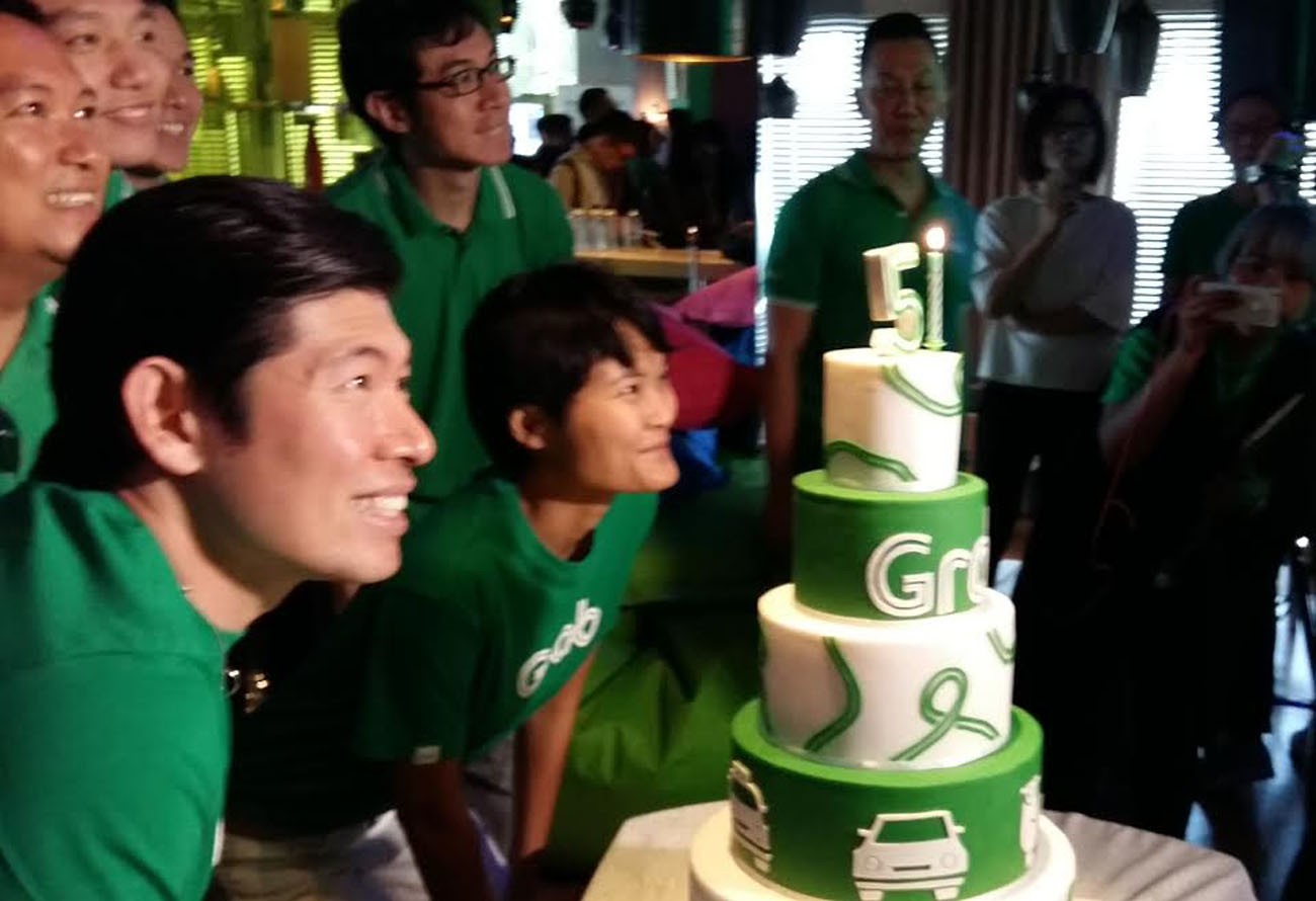 Grab CEO and co-founder Anthony Tan (left) and Grab co-founder Hooi-Ling Tan (right) celebrate Grab's fifth birthday in Singapore on June 6.