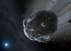 This is an artist impression obtained from The University of Warwick and The University of Cambridge shows a rocky and water-rich asteroid being torn apart by the strong gravity of the white dwarf star GD 61.