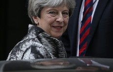 Britain's May apologises to own MPs for election 'mess'