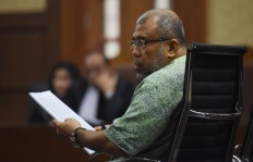 Patrialis Akbar's prison sentence cut to seven years