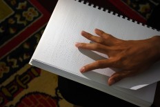 Malang mosque guides the blind with braille Quran