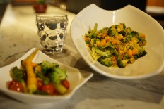 Aromatic fried rice by DoubleTree by Hilton Jakarta Diponegoro that is served alongside boiled vegetables. 