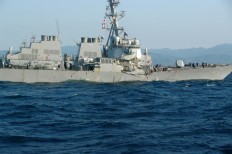 Seven US destroyer crew missing, commander hurt in crash off Japan
