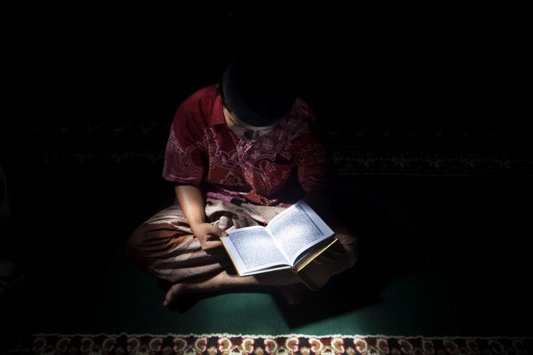 A student recites the Quran at the Lirboyo mosque. It is a routine activity for students at the boarding school. JP/Sigit Pamungkas.