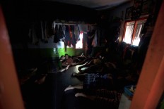 Students sleep without mattresses and have to cramp into a room. Sometimes they take turns to sleep because of limited space. JP/Sigit Pamungkas