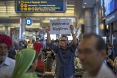 US six-country travel ban takes effect with few exceptions for relatives