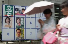 Tokyo votes in local polls with national consequences