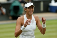 Muguruza stuns Venus to win first Wimbledon title
