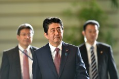 Japan PM Abe names new defence, foreign ministers in cabinet revamp 