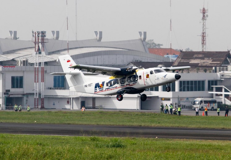 A N219 plane piloted by Captain Esther Gayatri flies during a flight test from Husein Sastranegara International Airport in Bandung on Aug. 17, 2017.