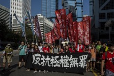 Crowds rally in Hong Kong after activists jailed