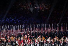 The Indonesian delegation (foreground) marches during the SEA Games opening ceremony. JP/Seto Wardhana