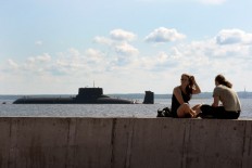 The Russian submarine Dmitry Donskoy (NATO - Typhoon class), the world's largest in active service, arrives at Kronstadt Navy base, outside Saint Petersburg, on July 26, 2017 to take part in the Naval Military Parade