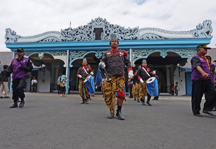 Royal soldiers walk in front of the Kamandungan gate of the Surakarta Palace during a ceremony in this undated photo.