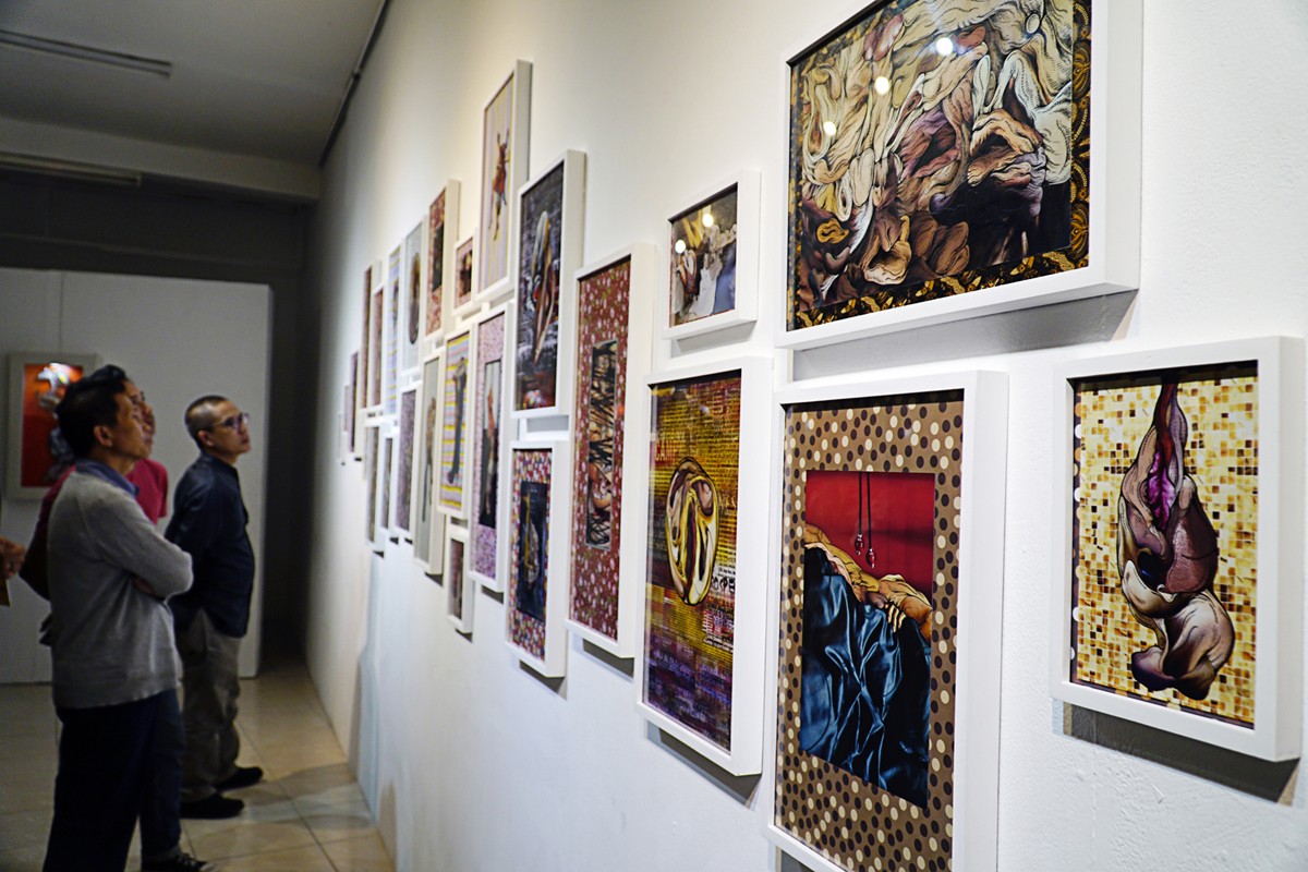 A show of creativity: Visitors enjoy artwork by artist Nandang Gawe.