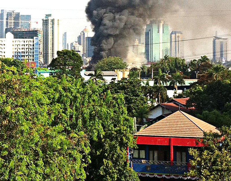 Burned down: Thick smoke emanates from houses in Bendungan Hilir, Central Jakarta, that were destroyed in a large fire on Saturday afternoon.