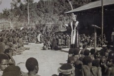 Old times: Father Frans Lieshout OFM delivers a sermon in Bilogai, now located in Intan Jaya regency. The church's early entry into Papua was not smooth. A missionary school was burned by locals in Baliem Valley in 1961. Courtesy of  Brother Jan Sjerp OFM, Father Lambertus H Hagendoorn OFM and Father Frans Lieshout OFM