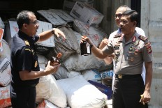 Pure alcohol, water mixed with branded liquor found in Central Jakarta