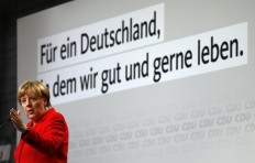 Merkel ends deadlock in coalition deal with social democrats 