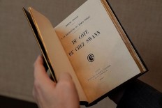 A Marcel Proust original edition of 'Du cote de chez Swann' (Swann's Way) is displayed at Sotheby's auction company in Paris on September 28, 2017, ahead of its scheduled sale on October 30. 
