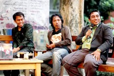 At ease: Hasan Abadi (right), rector of Raden Rahmat Islamic University, Kepanjen, Malang, East Java, speaks at the discussion. 