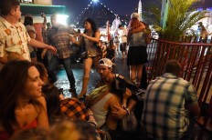 People run for cover at the Route 91 Harvest country music festival after apparent gun fire was heard on October 1, 2017 in Las Vegas, Nevada. There are reports of an active shooter around the Mandalay Bay Resort and Casino. AFP/Getty Images/David Becker