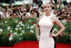 Kate Winslet shares a kiss with Allison Janney