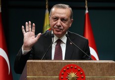 Turkey's Erdogan calls snap vote for first time in party history