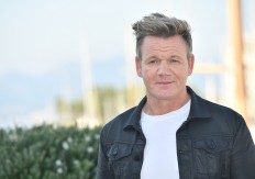 Gordon Ramsay poses during the MIPCOM trade show(standing for International Market of Communications Programmes) in Cannes, southern France, on October 16, 2017. 