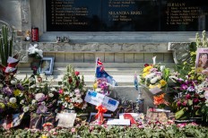 Flowers, letters, photographs and incense are laid at the monument to honor the Bali bombing victims. JP/Anggara Mahendra
