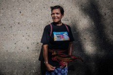 Ngesti Puji Rahayu, one of the 2002 bombing survivors, poses for a photo. She suffered burns on her left arm. JP/Anggara Mahendra