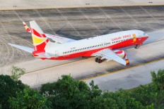 Another coin-tossing elderly Chinese causes flight chaos