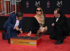 Mariah Carey spends night at hostel - in new commercial