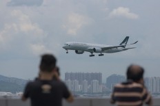 Hong Kong reduces COVID-19 quarantine for arrivals