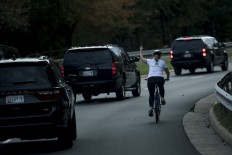 Cyclist who gave Trump the finger is showered with money