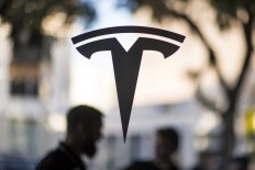 Tesla is a ‘hotbed for racist behavior,’ worker claims in suit