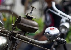 Two bells take center stage on a bicycle’s handlebar. JP/Tarko Sudiarno