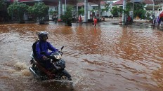 Thousands of houses submerged as North Sumatra flood cuts off cities, regencies
